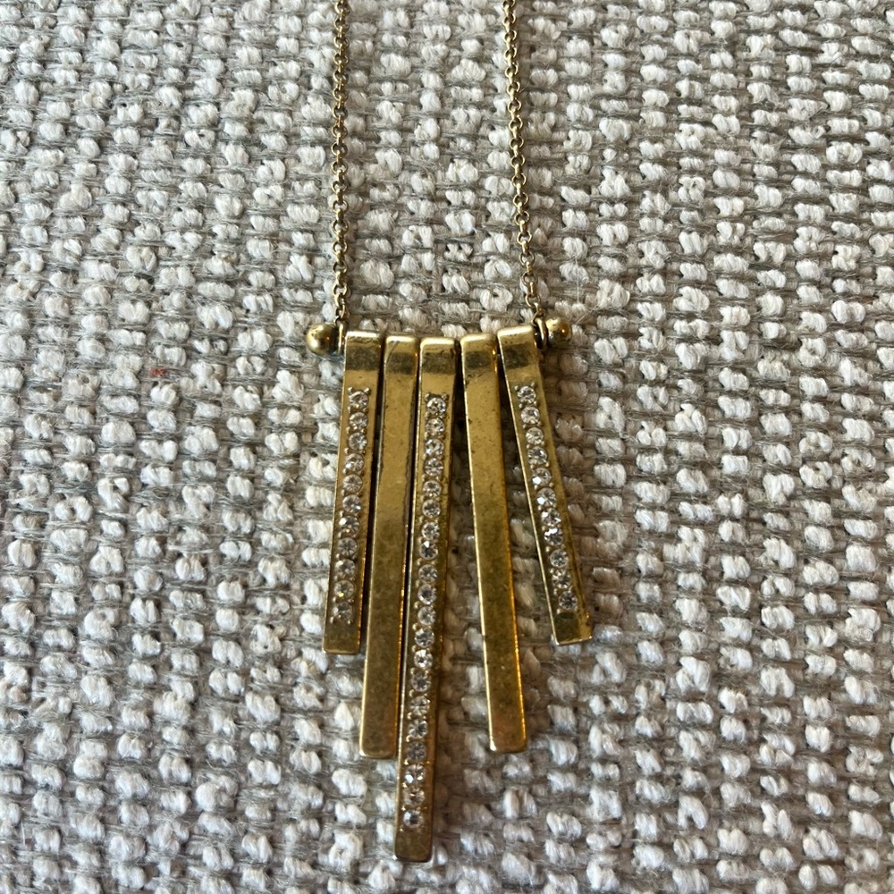 Long gold pendant necklace